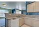 Kitchen featuring stainless steel sink, neutral granite countertop, wood cabinets and dishwasher at 7155 S Durango Dr # 303, Las Vegas, NV 89113