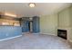 Expansive living area featuring fireplace, breakfast bar, and seamless flow to the kitchen for entertaining at 7155 S Durango Dr # 303, Las Vegas, NV 89113