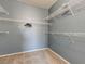 Spacious walk-in closet with carpet and ample shelving for storage solutions at 7155 S Durango Dr # 303, Las Vegas, NV 89113