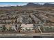 Expansive aerial view of a modern community featuring desert landscaping with mountains in the background at 752 Echelon St, Las Vegas, NV 89138