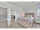 Relaxing bedroom with doorway to bathroom and cozy furnishings at 752 Echelon St, Las Vegas, NV 89138