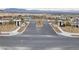 New community entrance with well maintained landscaping, a pool in view, and mountain views at 752 Echelon St, Las Vegas, NV 89138
