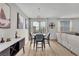 Bright dining area with stylish lighting, wine storage, and balcony access at 752 Echelon St, Las Vegas, NV 89138