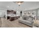 Open-concept living area with kitchen island, stainless appliances, and modern lighting at 752 Echelon St, Las Vegas, NV 89138