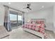 Bright main bedroom with balcony, en-suite bath, and a warm color palette at 752 Echelon St, Las Vegas, NV 89138