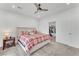 Cozy main bedroom featuring a comfortable bed, ceiling fan, and neutral carpet at 752 Echelon St, Las Vegas, NV 89138