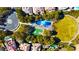 Aerial view of a neighborhood with a basketball court, pool and lush landscaping at 800 Jody Brook Ct, Las Vegas, NV 89145