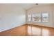 Bedroom with wood floors, ceiling fan, vaulted ceiling, and sunny windows at 8787 Roping Rodeo Ave # 101, Las Vegas, NV 89178