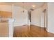 Dining area with wood floors adjacent to the kitchen at 8787 Roping Rodeo Ave # 101, Las Vegas, NV 89178