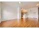 Open-concept layout with wood floors and a view of the kitchen at 8787 Roping Rodeo Ave # 101, Las Vegas, NV 89178