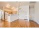 Open-concept living area with wood floors flowing into the kitchen at 8787 Roping Rodeo Ave # 101, Las Vegas, NV 89178