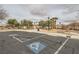 View of a parking lot, complete with handicap parking at 8787 Roping Rodeo Ave # 101, Las Vegas, NV 89178