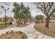 Community playground with walking paths and green space at 8787 Roping Rodeo Ave # 101, Las Vegas, NV 89178
