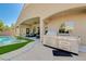 Outdoor kitchen, bar-b-q, and covered patio next to the pool make this back yard an entertainer's dream at 9108 Tuxpan St, Las Vegas, NV 89131