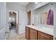 Bathroom with wood cabinets and white counter at 9108 Tuxpan St, Las Vegas, NV 89131