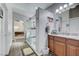 Modern bathroom featuring a glass-enclosed shower and double vanity with marble countertops at 9108 Tuxpan St, Las Vegas, NV 89131