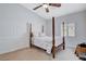 Bedroom with floral bedding and a four-poster bed at 9108 Tuxpan St, Las Vegas, NV 89131