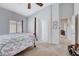 Bedroom with floral bedding and neutral carpet at 9108 Tuxpan St, Las Vegas, NV 89131