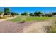 Green lawn is surrounded by stone walkways and professionally maintained landscaping at 9108 Tuxpan St, Las Vegas, NV 89131
