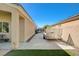 Wide driveway leading to a backyard gate, perfect for RV or boat storage, with lush landscaping at 9108 Tuxpan St, Las Vegas, NV 89131
