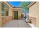 Side entryway features stone accents, an iron gate and a convenient side door at 9108 Tuxpan St, Las Vegas, NV 89131