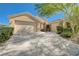 Home with desert landscaping, spacious driveway, and a two-car garage, plus additional garage space at 9108 Tuxpan St, Las Vegas, NV 89131