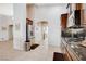 Contemporary kitchen with stainless steel refrigerator and direct access to the laundry room at 9108 Tuxpan St, Las Vegas, NV 89131
