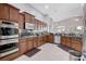 Well-equipped kitchen featuring stainless steel appliances and dark wood cabinetry at 9108 Tuxpan St, Las Vegas, NV 89131