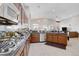 Stylish kitchen with granite counters, stainless appliances, and a great view of the open floor plan at 9108 Tuxpan St, Las Vegas, NV 89131