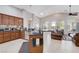 Open-concept kitchen with granite countertops, stainless steel appliances, and a breakfast bar at 9108 Tuxpan St, Las Vegas, NV 89131