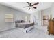 Spacious main bedroom featuring carpet floors, ceiling fan, and ensuite access at 9108 Tuxpan St, Las Vegas, NV 89131