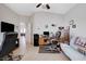 Spacious home office featuring a vaulted ceiling, ceiling fan, and comfortable workspace with natural light at 9108 Tuxpan St, Las Vegas, NV 89131