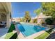 Beautiful pool area with mature landscaping and mountain views from the covered patio at 9108 Tuxpan St, Las Vegas, NV 89131