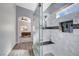 Shower with seat, rain shower, and tiled surround at 9108 Tuxpan St, Las Vegas, NV 89131