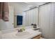 Bathroom vanity showcasing a sink, and framed mirror at 938 Carnival Ave, Las Vegas, NV 89123