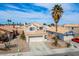Charming two-story home with a well-maintained lawn, desert landscaping, and an attached two-car garage at 938 Carnival Ave, Las Vegas, NV 89123