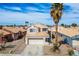 Well-maintained single-Gathering home with a two-car garage and desert-friendly landscaping at 938 Carnival Ave, Las Vegas, NV 89123