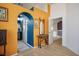 Hallway showcasing orange walls and a blue archway leading to the bathroom at 938 Carnival Ave, Las Vegas, NV 89123