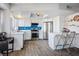 Bright kitchen with white cabinets, stainless steel appliances, and island seating at 938 Carnival Ave, Las Vegas, NV 89123