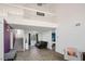 Open concept living room with tile flooring, stairs and a second-floor balcony at 938 Carnival Ave, Las Vegas, NV 89123