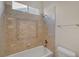 Bright bathroom with decorative tile work around the bathtub and an overhead shower head at 9485 Parkmoor Ave, Las Vegas, NV 89149