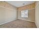 Empty bedroom with window and carpeted floor at 9485 Parkmoor Ave, Las Vegas, NV 89149