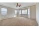 Bedroom with large windows and patterned wallpaper at 9485 Parkmoor Ave, Las Vegas, NV 89149
