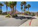 Gated entrance of Valley Crest with mature palm trees offering secure and stylish community living at 9485 Parkmoor Ave, Las Vegas, NV 89149