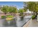 The gated entrance to the Valley Crest community is surrounded by mature trees and landscaping at 9485 Parkmoor Ave, Las Vegas, NV 89149