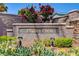 Community sign for Valley Crest featuring beautiful flowering trees and manicured landscaping at 9485 Parkmoor Ave, Las Vegas, NV 89149