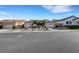 Charming single-story home with a three-car garage, desert landscaping, and stone accents at 9485 Parkmoor Ave, Las Vegas, NV 89149