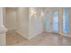 Bright foyer showcasing tiled flooring, decorative sconces, and a decorative front door at 9485 Parkmoor Ave, Las Vegas, NV 89149