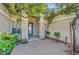 Charming home entrance with stone pillar accents, plants, and a patterned walkway at 9485 Parkmoor Ave, Las Vegas, NV 89149