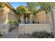 Cozy home entrance featuring stone pillar accents and desert landscaping at 9485 Parkmoor Ave, Las Vegas, NV 89149